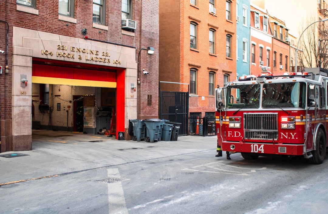 Fire station and a fire truck are visible.