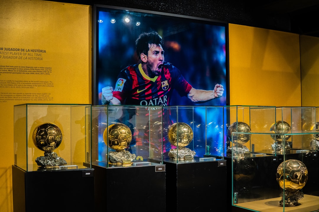a person standing behind trophies