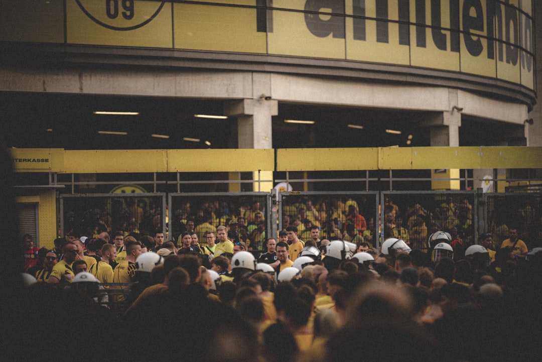 a crowd of people standing in front of a building