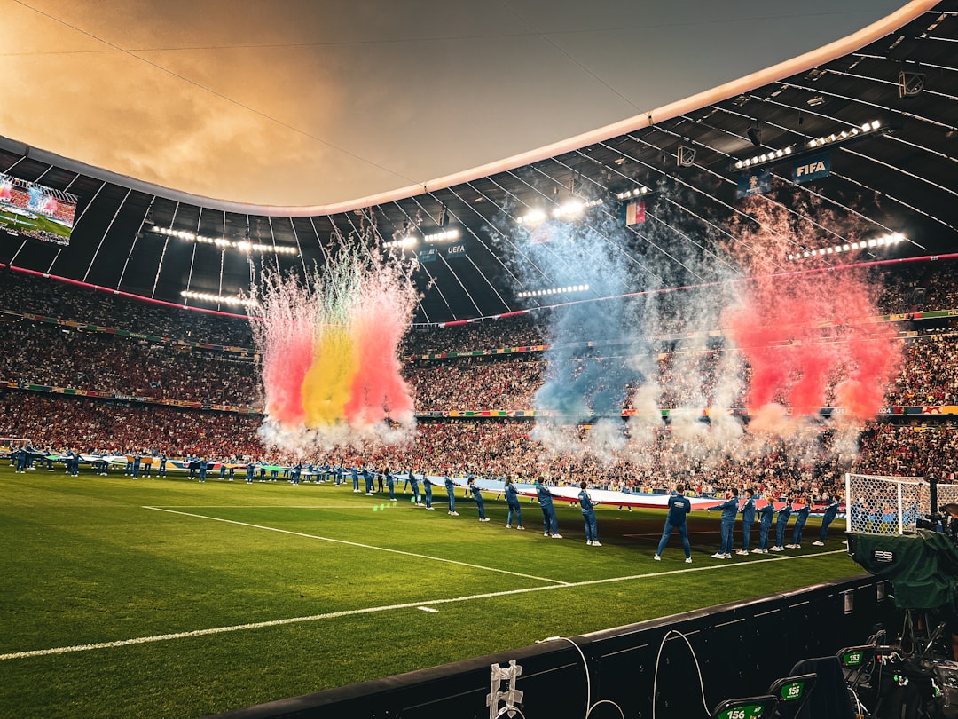 A stadium filled with lots of people watching a soccer game