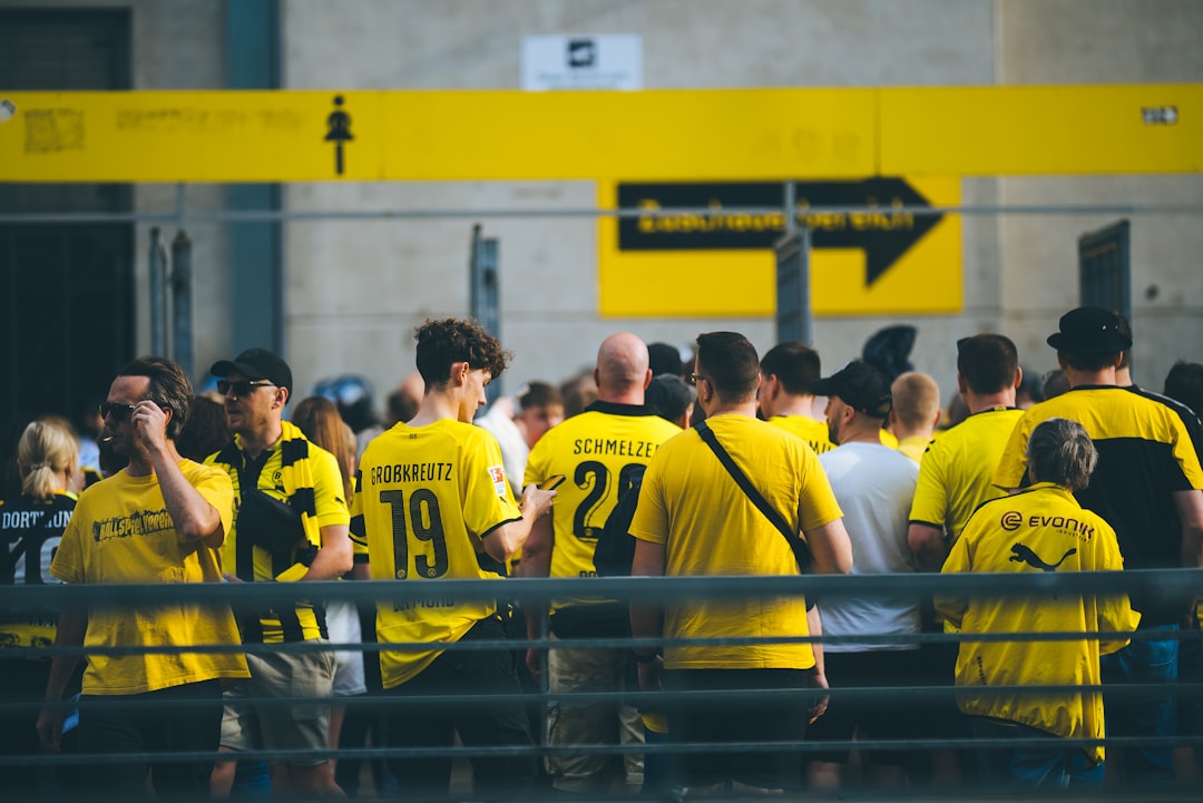 a group of people in yellow shirts standing together